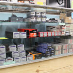 Selection of rifle scopes and gun accessories